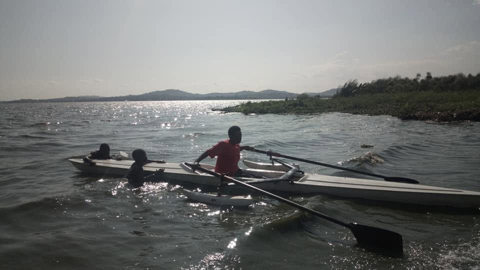 Two rowing boats out on open water in the distance.