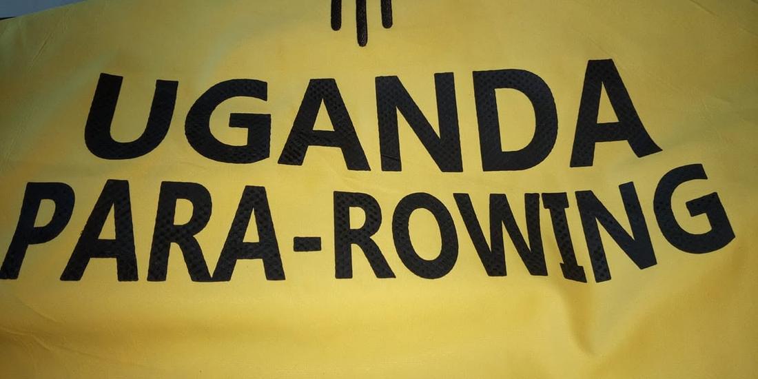A 'Uganda Para-Rowing' banner on display at a competition venue.