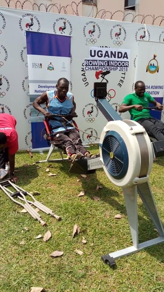 A coach works one-to-one with an athlete on ergometer technique.