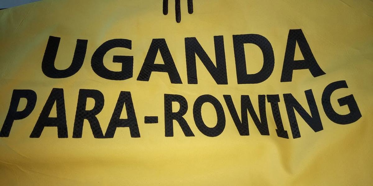 A Uganda Para-Rowing signage board at a competition venue.